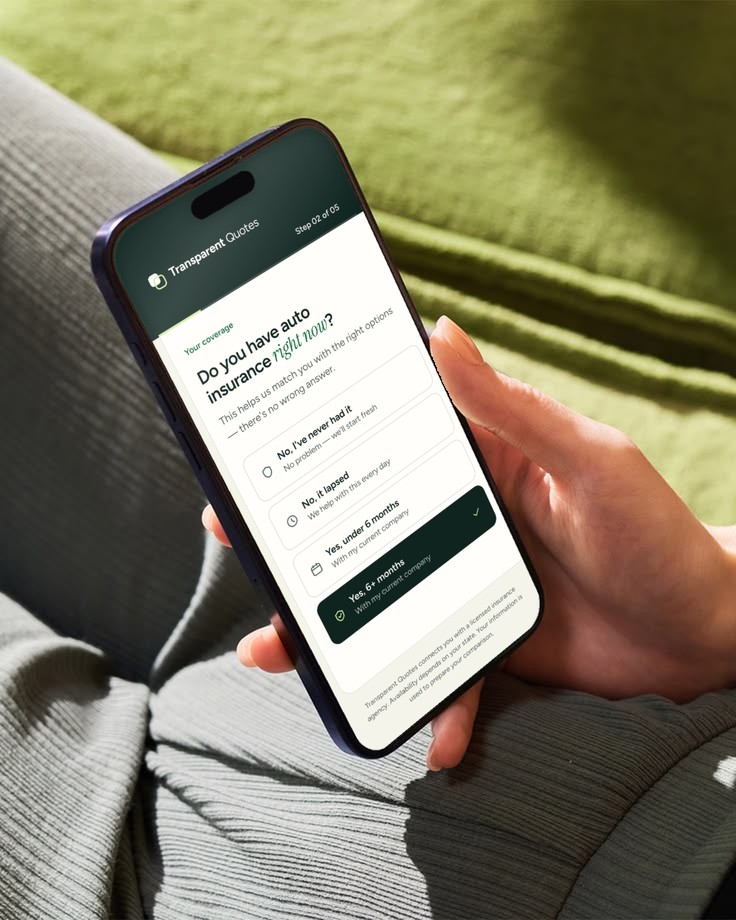 A hand holding a phone showing the Transparent Quotes questions.